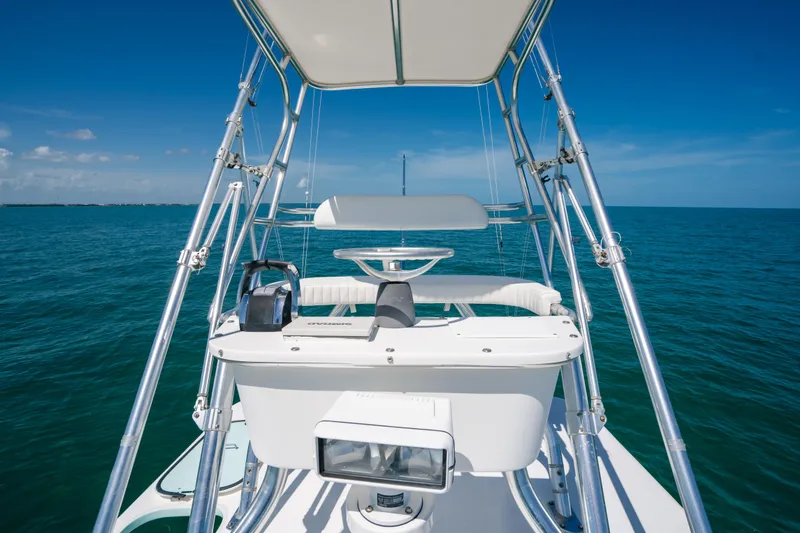 Slide: The Image of 2006 Venture 39 Open boat on calm ocean waters under clear blue sky. - 35