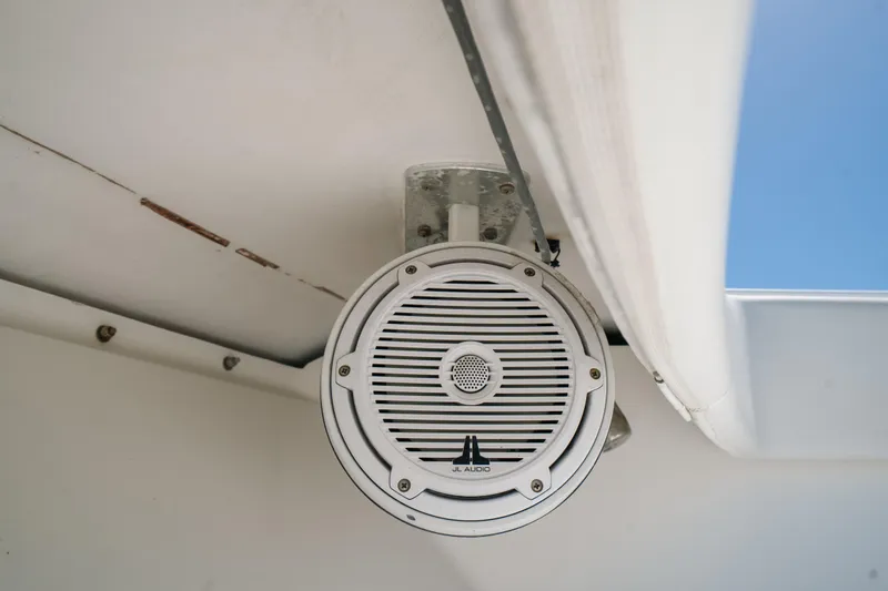 Slide: The Image of Boat speaker on a 2006 Venture 39 Open, mounted under a white canopy. - 38