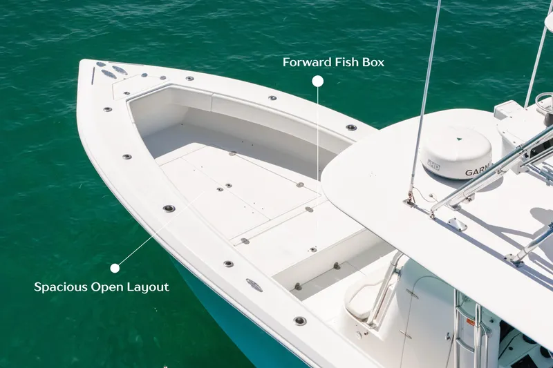 Slide: The Image of 2006 Venture 39 Open boat with spacious layout and forward fish box on turquoise water. - 4