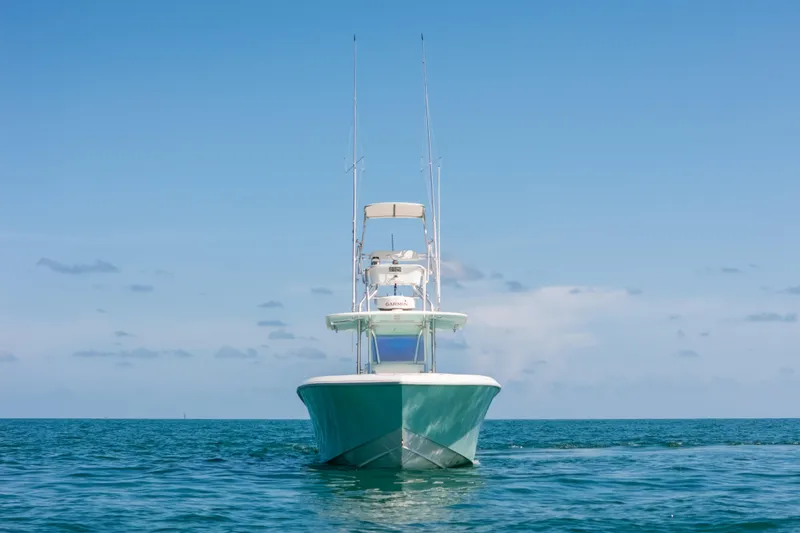 Slide: The Image of 2006 Venture 39 Open boat on calm ocean under clear blue sky. - 44