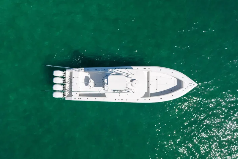 Slide: The Image of Aerial view of 2006 Venture 39 Open boat on turquoise water. - 8