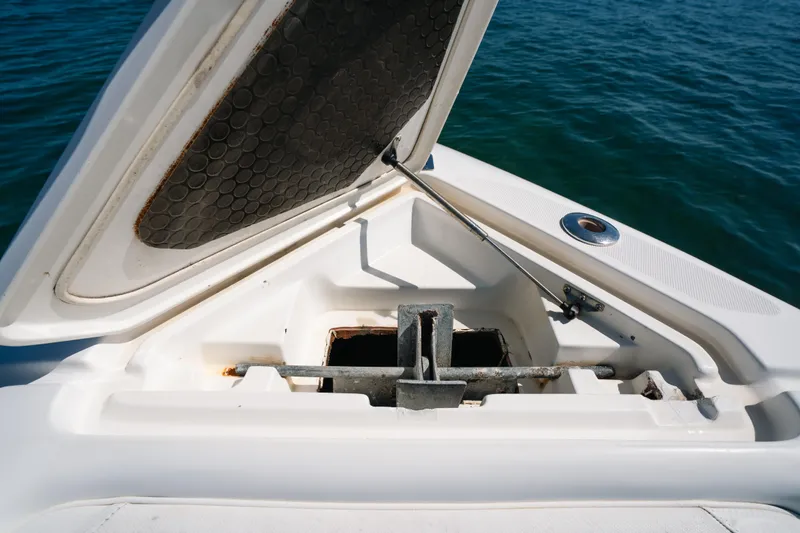 Slide: The Image of Open anchor compartment on 2013 Deep Impact 33 boat, with ocean background. - 12