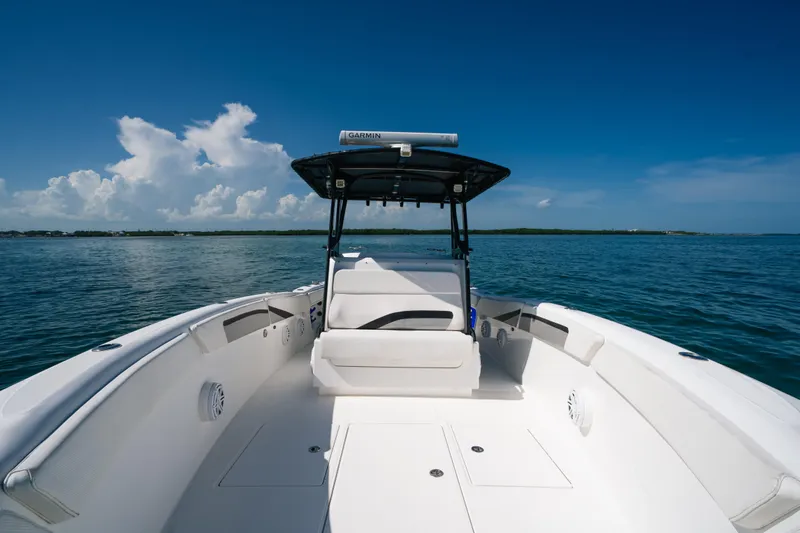 Slide: The Image of 2013 Deep Impact 33 boat on calm ocean with clear blue sky. - 13
