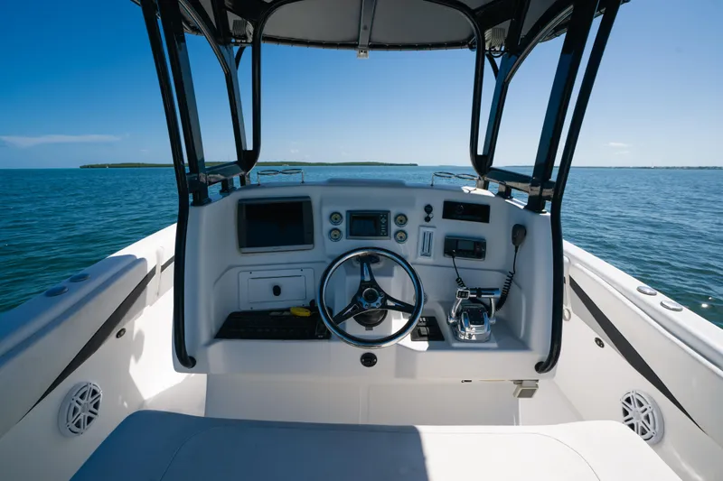 Slide: The Image of Cockpit view of 2013 Deep Impact 33 boat on open water. - 16