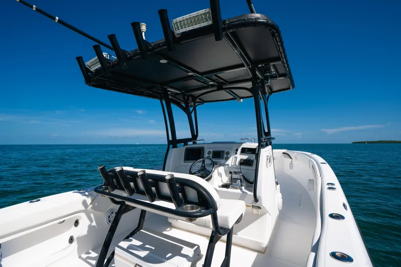 Slide: The Image of 2013 Deep Impact 33 boat on open water, featuring sleek design and modern controls. - 18