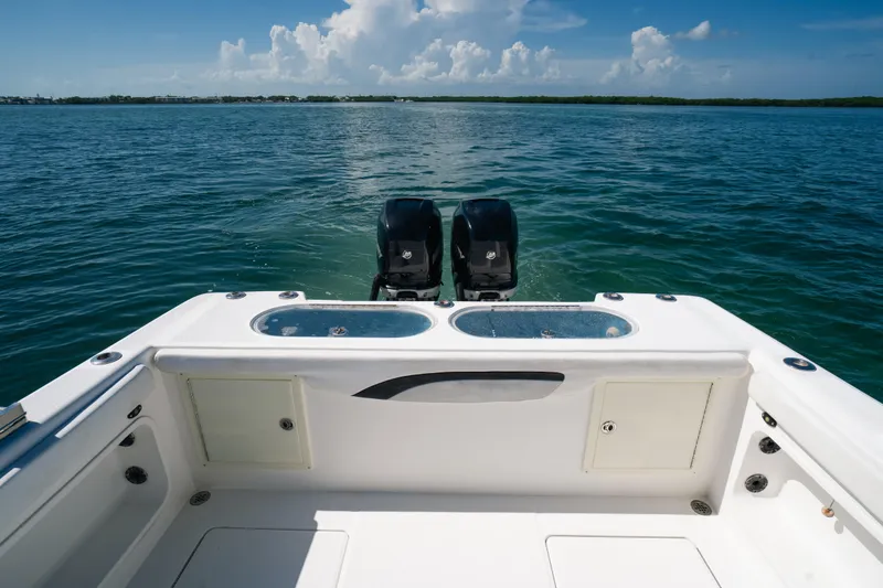 Slide: The Image of 2013 Deep Impact 33 boat with dual engines on open water. - 21