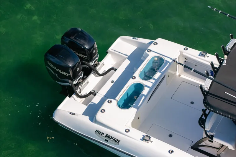 Slide: The Image of 2013 Deep Impact 33 boat with dual Mercury engines on clear water. - 6