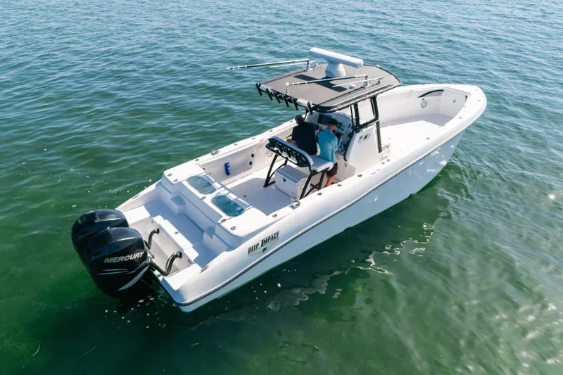 Slide: The Image of 2013 Deep Impact 33 boat on water, featuring dual Mercury engines. - 8
