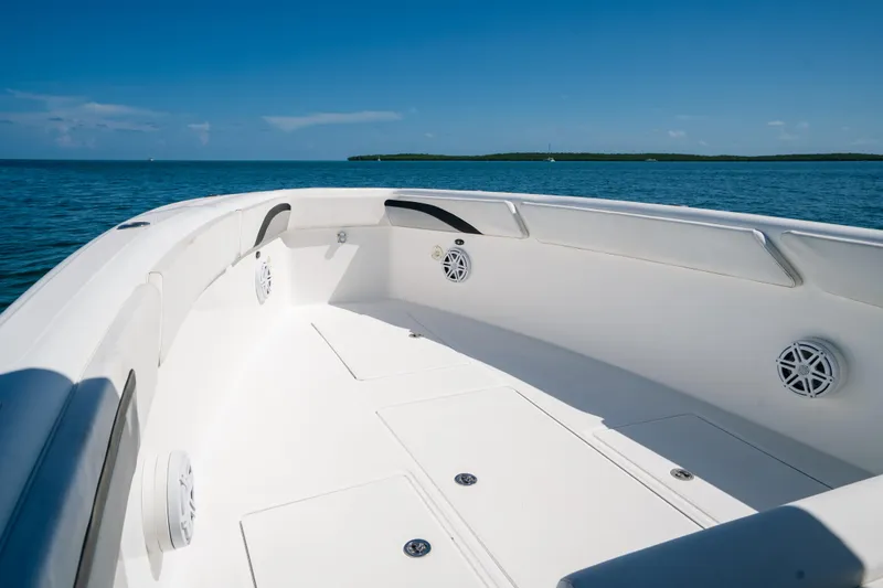 Slide: The Image of 2013 Deep Impact 33 boat interior with ocean view, showcasing sleek design and spacious deck. - 9