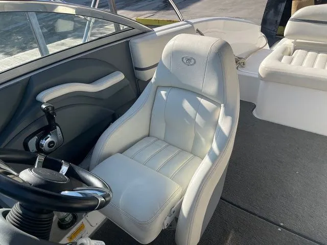 Slide: The Image of 2016 Cobalt R3 boat interior with white leather seating and steering wheel. - 16