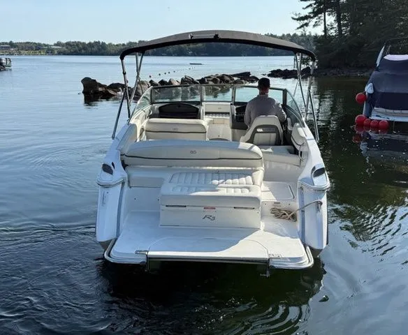 Slide: The Image of 2016 Cobalt R3 boat on calm water, rear view with canopy and seating. - 7