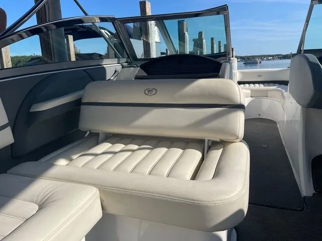 Slide: The Image of 2016 Cobalt R3 boat interior with white leather seating and open deck view. - 8