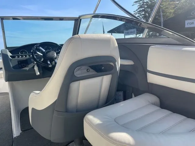 Slide: The Image of Interior of a 2016 Cobalt R3 boat with white and gray seating. - 9