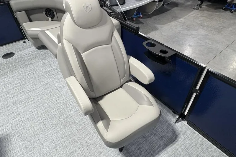 Slide: The Image of Luxurious seating on 2026 Premier 220 Sunscape RF boat, featuring plush upholstery and armrests. - 11