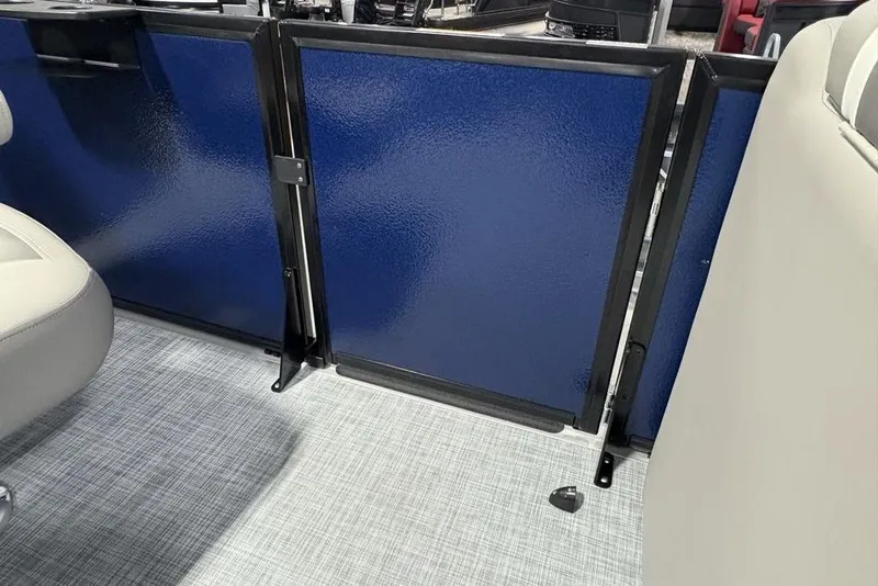 Slide: The Image of Interior view of 2026 Premier 220 Sunscape RF boat with blue panel and seating. - 12