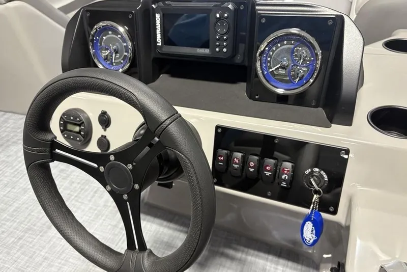 Slide: The Image of Steering console of 2026 Premier 220 Sunscape RF with gauges and controls. - 16