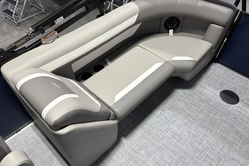 Slide: The Image of 2026 Premier 220 Sunscape RF boat interior with gray cushioned seating and cup holders. - 19