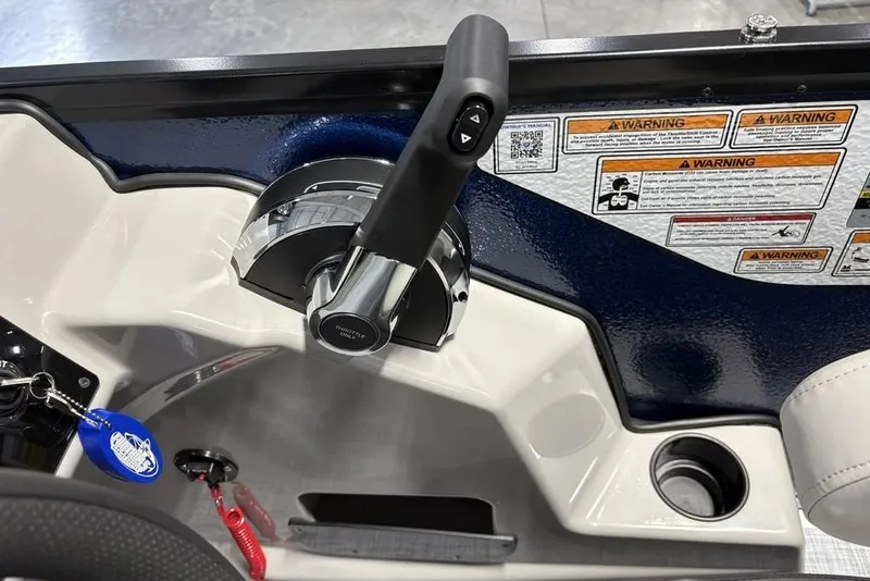 Slide: The Image of Throttle control panel of 2026 Premier 220 Sunscape RF boat with warning labels. - 20