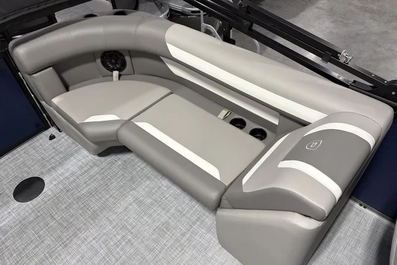 Slide: The Image of 2026 Premier 220 Sunscape RF boat interior with gray and white cushioned seating. - 22