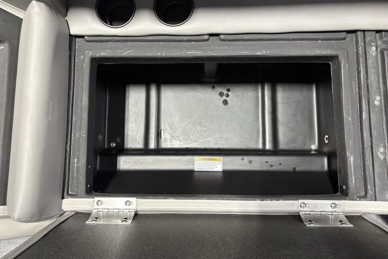 Slide: The Image of Open storage compartment in 2026 Premier 220 Sunscape RF boat interior. - 24