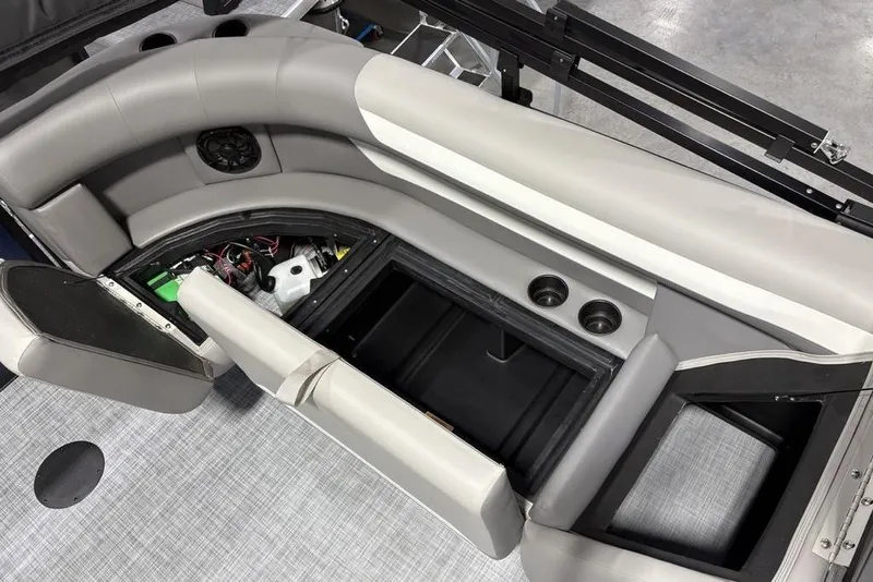 Slide: The Image of Interior view of 2026 Premier 220 Sunscape RF boat with open storage compartments. - 25