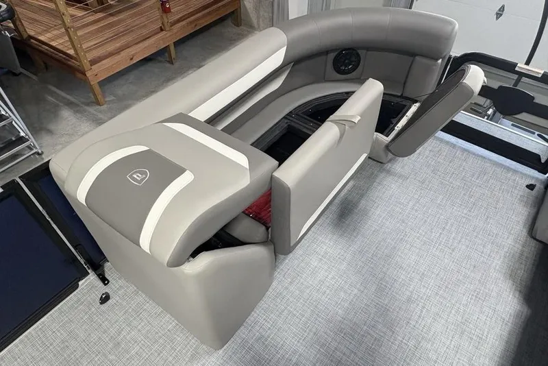 Slide: The Image of 2026 Premier 220 Sunscape RF boat interior with gray seating and storage compartments. - 8