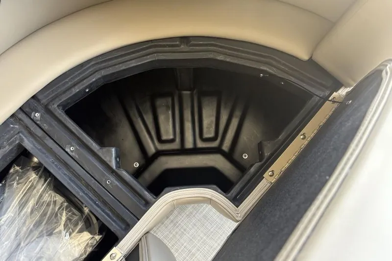 Slide: The Image of Storage compartment of 2026 Premier 220 Sunscape RF boat, featuring durable interior design. - 13