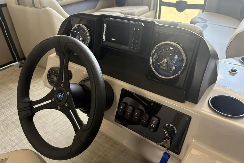 Slide: The Image of Steering console of 2026 Premier 220 Sunscape RF boat with gauges and controls. - 14