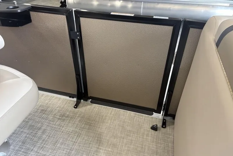 Slide: The Image of 2026 Premier 220 Sunscape RF interior with beige seating and textured flooring. - 17