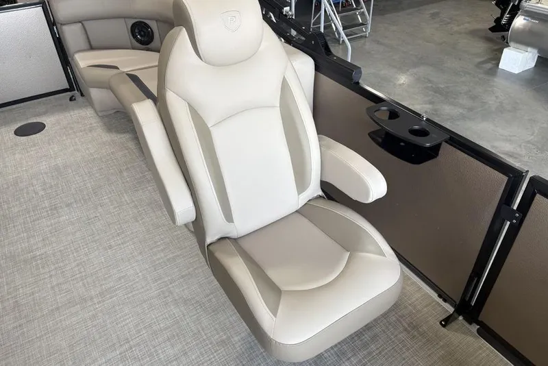 Slide: The Image of 2026 Premier 220 Sunscape RF boat interior with luxurious seating and cup holders. - 19