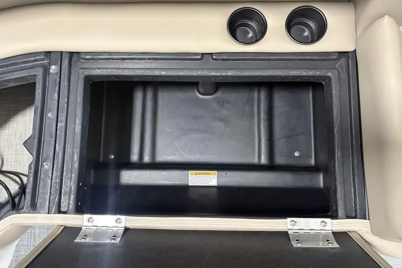 Slide: The Image of Open storage compartment in 2026 Premier 220 Sunscape RF boat interior. - 26