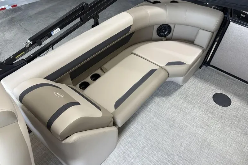 Slide: The Image of Luxurious seating in the 2026 Premier 220 Sunscape RF boat, featuring beige upholstery. - 27