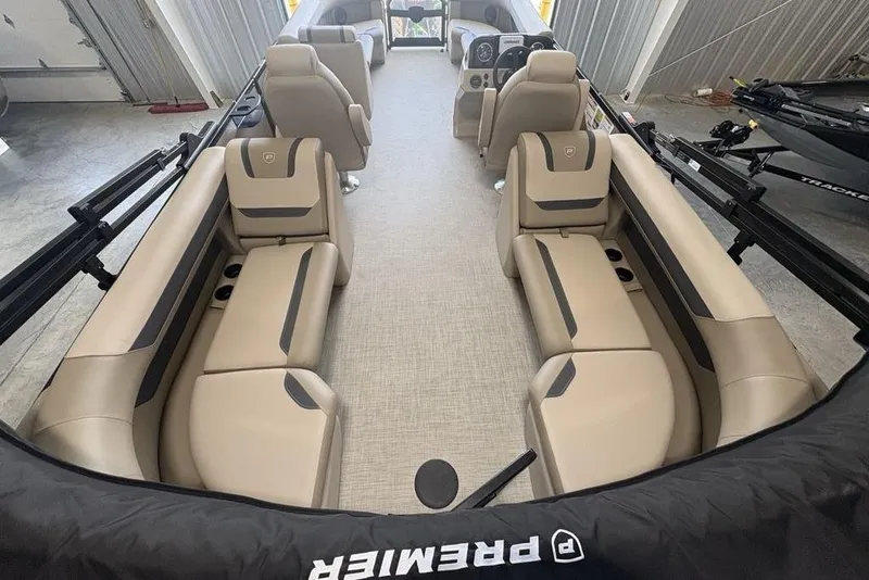 Slide: The Image of 2026 Premier 220 Sunscape RF boat interior with beige seating and modern design. - 30