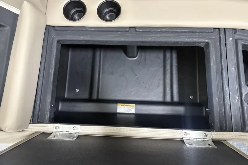 Slide: The Image of Open storage compartment in 2026 Premier 220 Sunscape RF boat interior. - 32