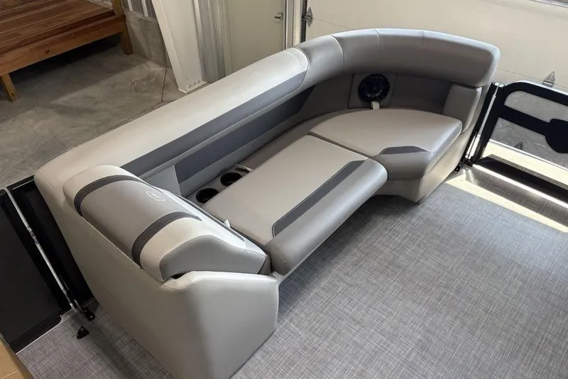 Slide: The Image of Luxurious seating in 2026 Premier 220 Sunscape RF XLC pontoon boat, featuring sleek gray upholstery. - 10