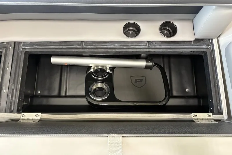 Slide: The Image of Storage compartment in 2026 Premier 220 Sunscape RF XLC boat with cup holders. - 11