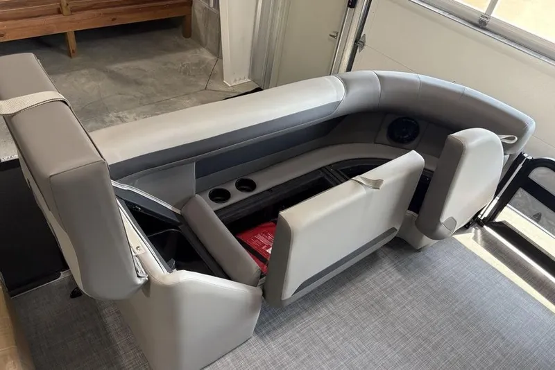 Slide: The Image of Interior seating of 2026 Premier 220 Sunscape RF XLC boat with storage compartments. - 12
