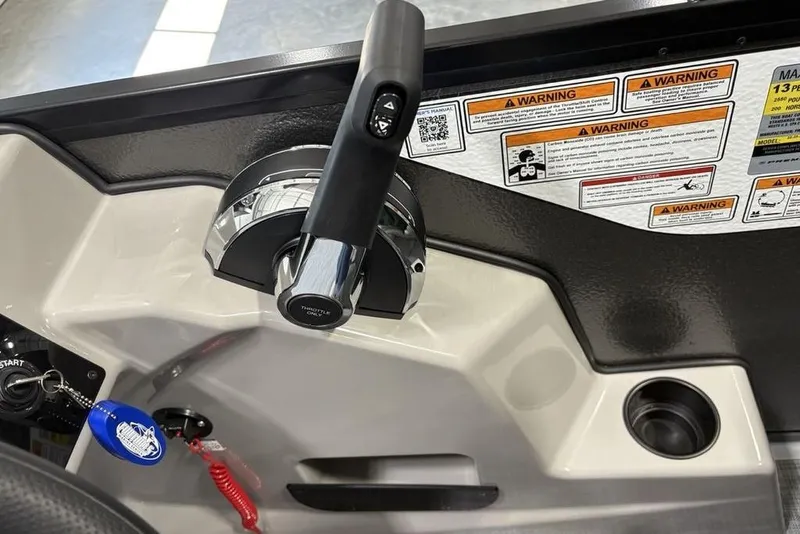 Slide: The Image of Throttle control panel of 2026 Premier 220 Sunscape RF XLC with warning labels. - 17