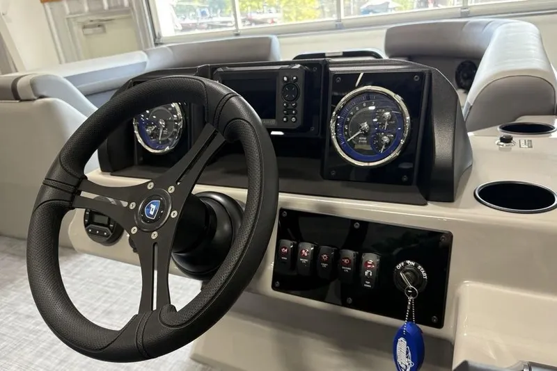 Slide: The Image of Steering console of 2026 Premier 220 Sunscape RF XLC boat with gauges and controls. - 18
