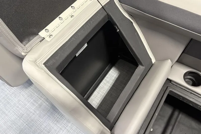 Slide: The Image of Open storage compartment in 2026 Premier 220 Sunscape RF XLC boat interior. - 24