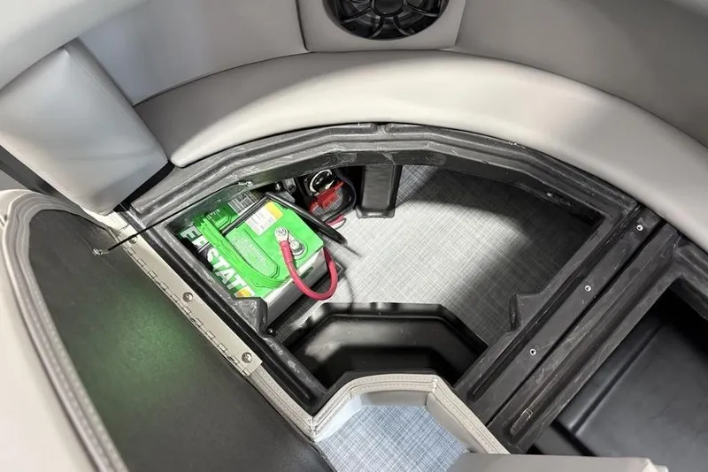 Slide: The Image of Battery compartment of 2026 Premier 220 Sunscape RF XLC boat, featuring Interstate battery. - 32