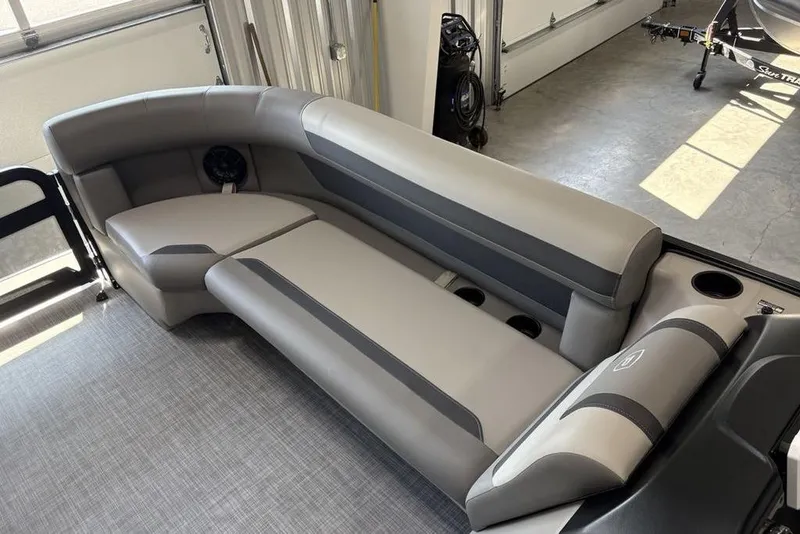 Slide: The Image of Luxurious seating in 2026 Premier 220 Sunscape RF XLC boat, featuring sleek gray upholstery. - 5