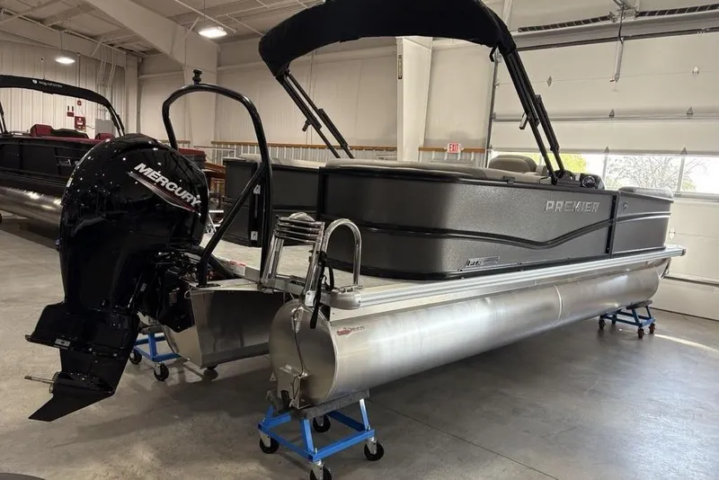 Slide: The Image of 2026 Premier 220 Sunscape RF XLC pontoon boat with Mercury outboard motor in showroom. - 7