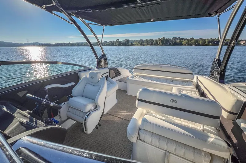 Slide: The Image of 2018 Cobalt R5 boat interior with luxurious seating on a serene lake. - 17