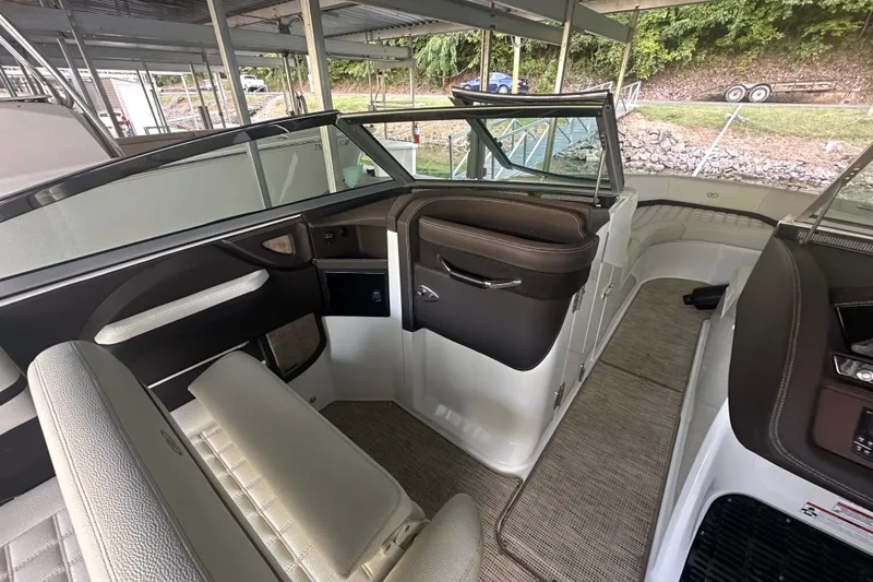 Slide: The Image of 2018 Cobalt R5 boat cruising on a lake with two passengers. - 6