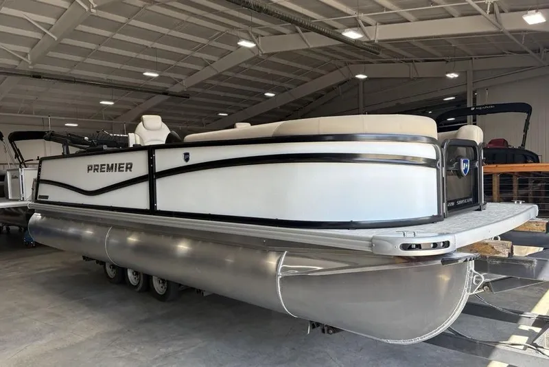 Slide: The Image of Interior view of 2026 Premier 220 SUNSCAPE RL boat, featuring a gate and beige seating. - 16