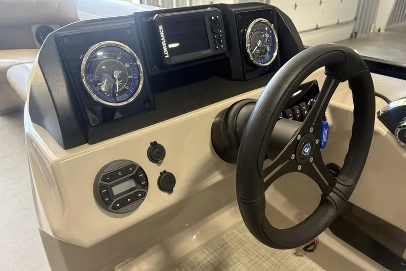 Slide: The Image of Control panel of 2026 Premier 220 SUNSCAPE RL boat with buttons and display. - 17