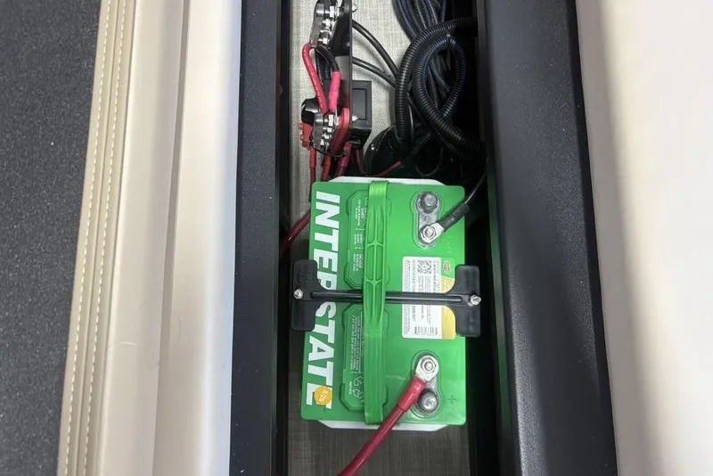 Slide: The Image of Premier 220 SUNSCAPE RL 2026 boat seating with cup holders and speaker. - 25