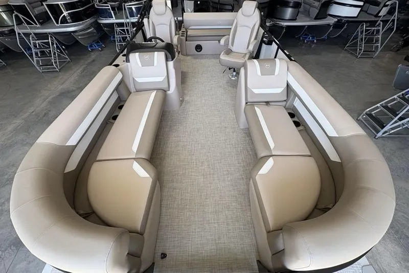 Slide: The Image of 2026 Premier 220 SUNSCAPE RL pontoon boat interior with beige seating and modern design. - 27