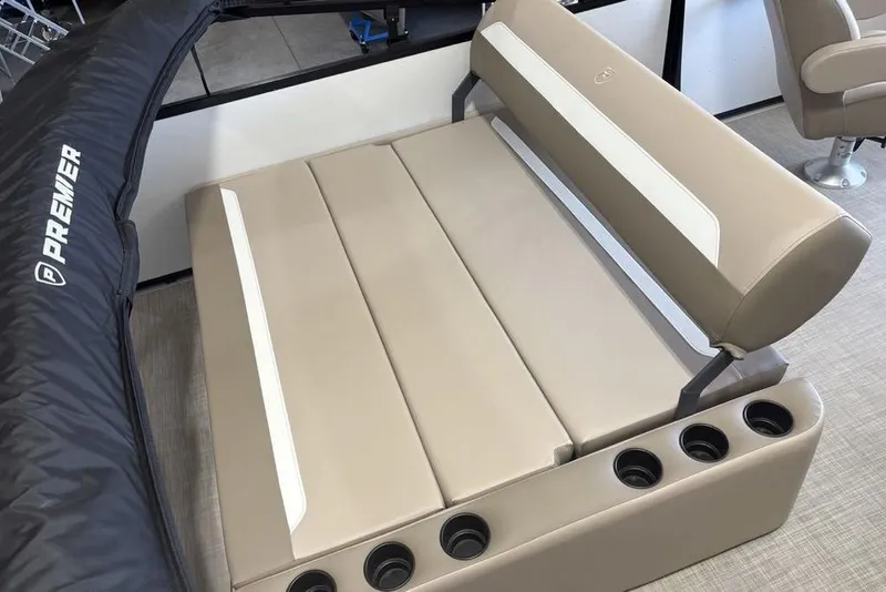 Slide: The Image of Control panel of 2026 Premier 220 SUNSCAPE RL boat with throttle and warning labels. - 15